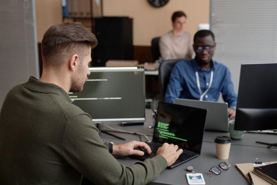 Cybersecurity Developer Working on Laptop